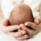 mother holding baby