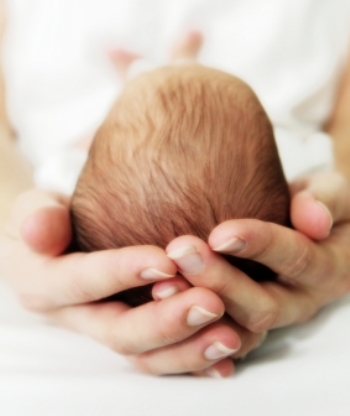 mother holding baby