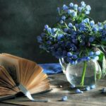 book and blue flowers