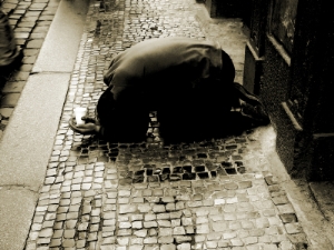man kneeling on the street