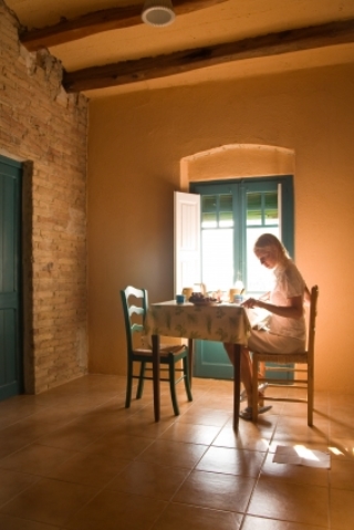 female at table writing